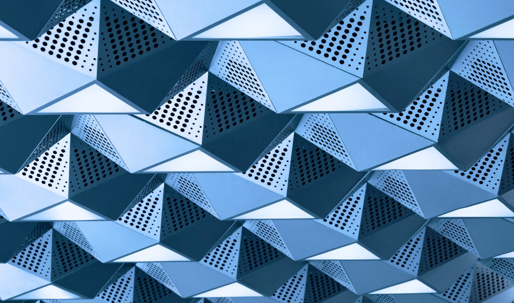 Folded perforated metal facade panels